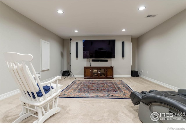 carpeted living room featuring recessed lighting, visible vents, and baseboards