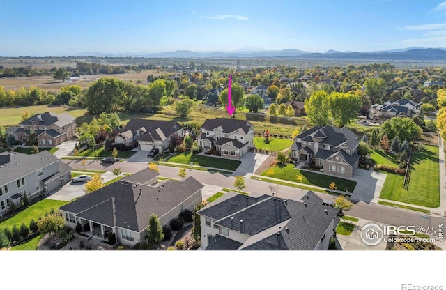 drone / aerial view with a mountain view and a residential view