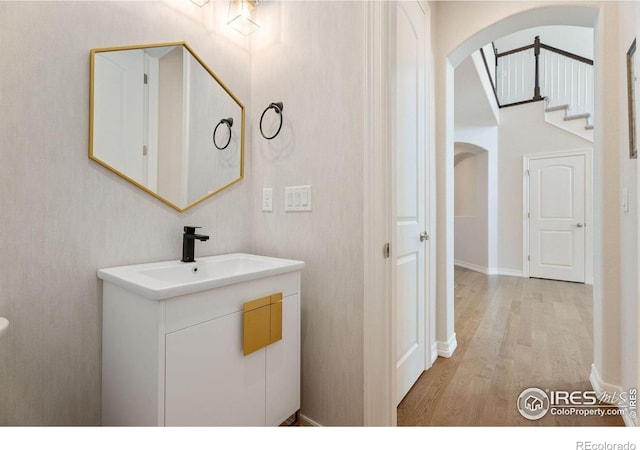 bathroom featuring vanity and wood finished floors