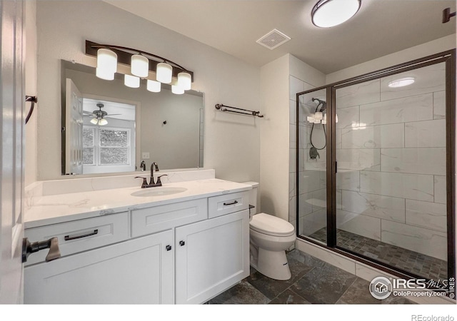 full bath featuring toilet, vanity, visible vents, marble finish floor, and a shower stall