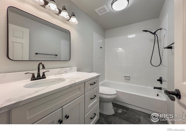 bathroom with toilet, tub / shower combination, vanity, and visible vents