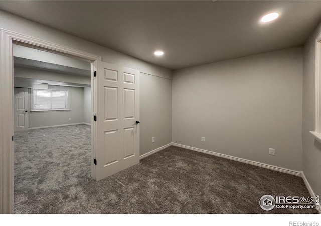 spare room with carpet floors, baseboards, and recessed lighting