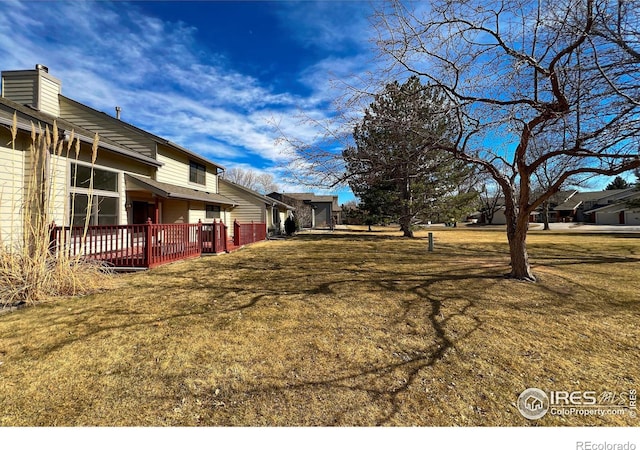 view of yard with a deck