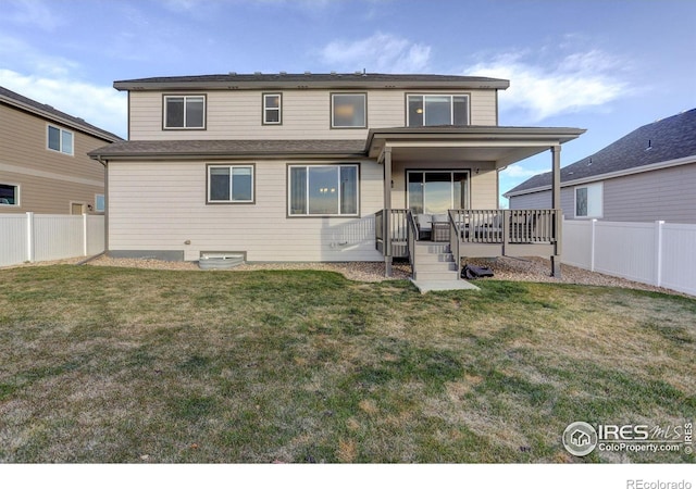 rear view of property with a porch, a lawn, and a fenced backyard