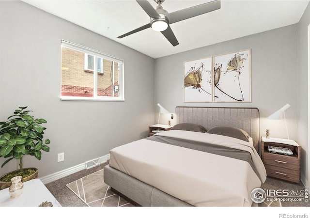 bedroom featuring a ceiling fan, carpet flooring, baseboards, and visible vents