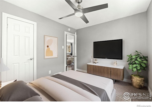 bedroom with baseboards, light carpet, and ceiling fan