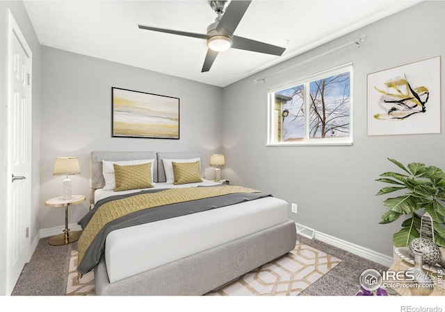 carpeted bedroom with baseboards and ceiling fan