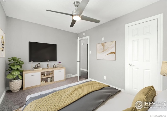 bedroom featuring visible vents, baseboards, a ceiling fan, and carpet flooring