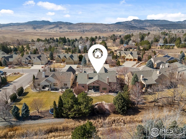 drone / aerial view featuring a mountain view and a residential view