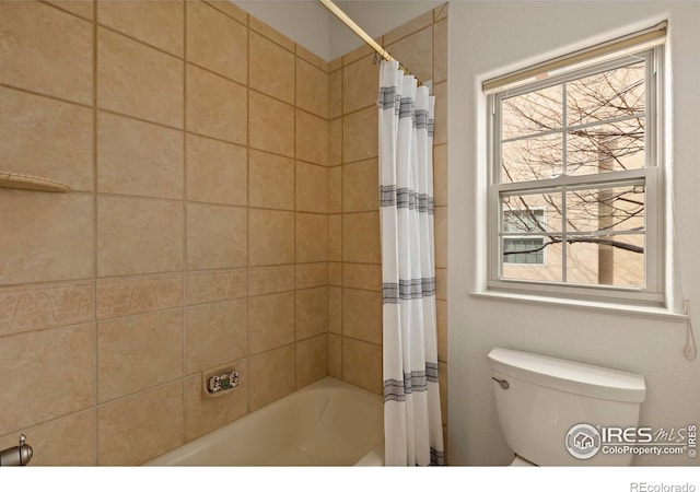 bathroom with toilet, shower / bath combination with curtain, and plenty of natural light