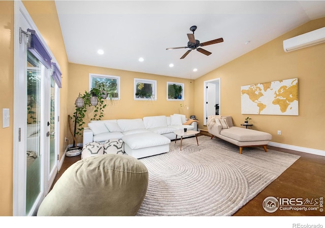 living area featuring a wall unit AC, baseboards, recessed lighting, ceiling fan, and vaulted ceiling