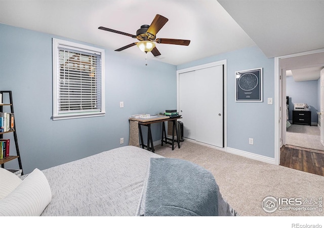 bedroom with carpet, baseboards, a closet, and ceiling fan