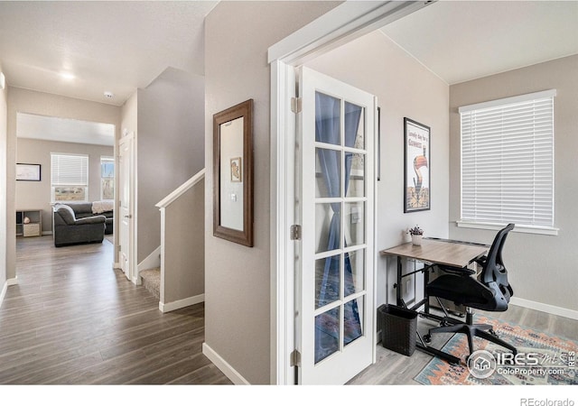 office area with baseboards and wood finished floors