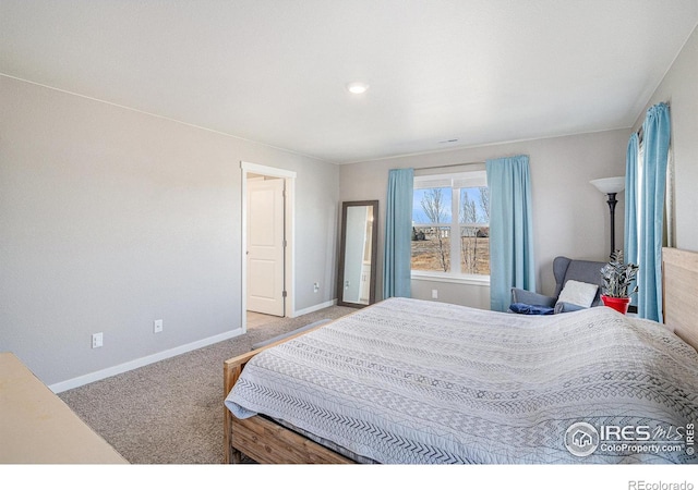 carpeted bedroom with baseboards