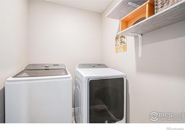 washroom featuring laundry area and washer and dryer