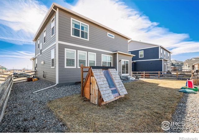 back of property with a fenced backyard