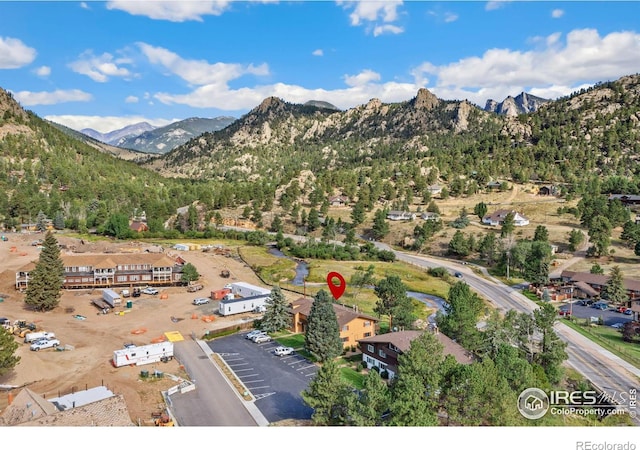 birds eye view of property with a mountain view