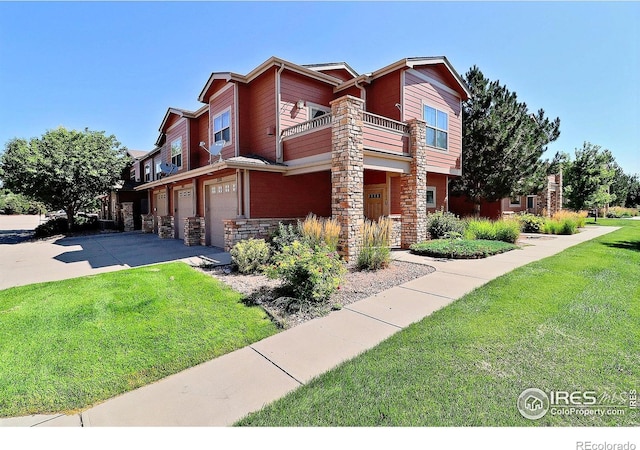 view of home's exterior with a balcony, a lawn, and a garage