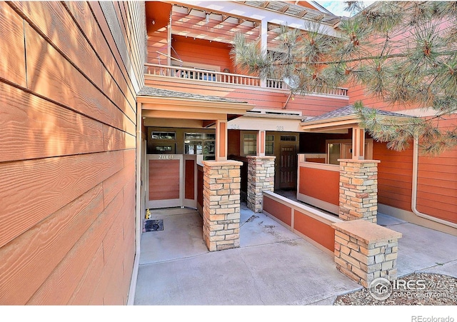 view of patio with a balcony