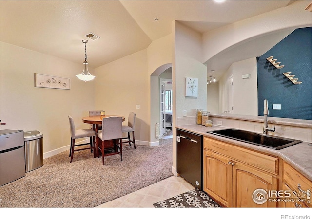 kitchen with visible vents, arched walkways, a sink, light carpet, and dishwasher