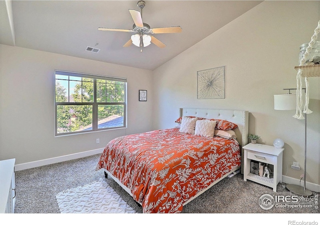 carpeted bedroom with lofted ceiling, visible vents, baseboards, and ceiling fan