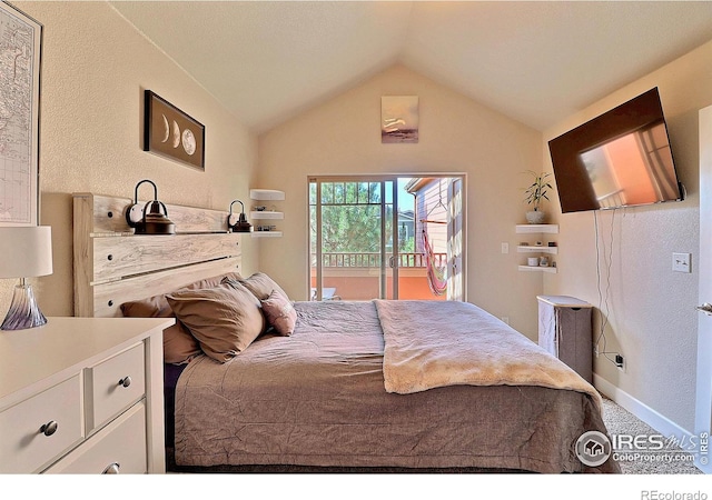 bedroom with vaulted ceiling, access to outside, and baseboards