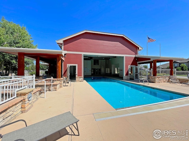 pool with a patio area