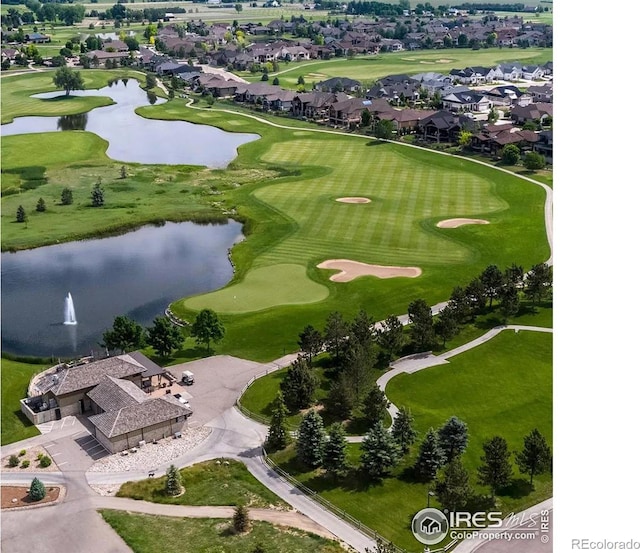 bird's eye view with golf course view and a water view