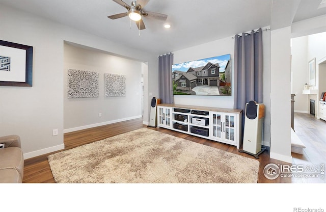 890 Meadowlark Dr, Erie, CO 80516 - cinema featuring wood finished floors, baseboards, and ceiling fan