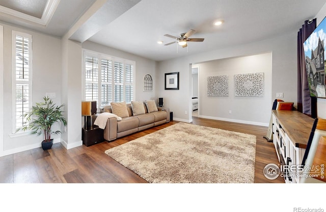 890 Meadowlark Dr, Erie, CO 80516 - living room with baseboards, dark wood-style flooring, a wealth of natural light, and ceiling fan