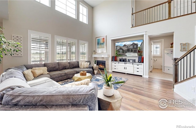 890 Meadowlark Dr, Erie, CO 80516 - living room with light wood finished floors and a tile fireplace