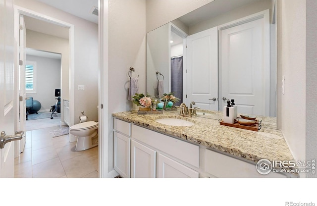 890 Meadowlark Dr, Erie, CO 80516 - full bathroom with tile patterned flooring, visible vents, toilet, and vanity