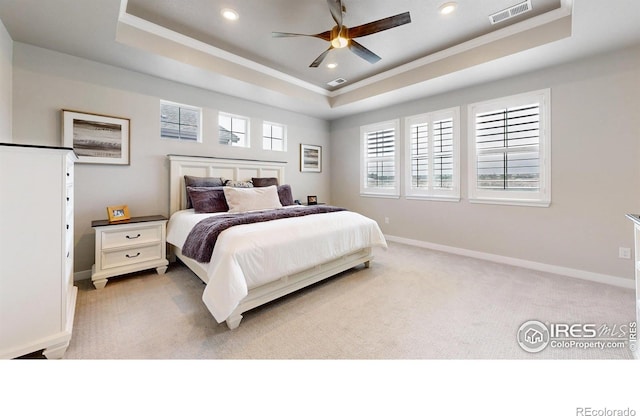 890 Meadowlark Dr, Erie, CO 80516 - bedroom featuring baseboards, visible vents, a raised ceiling, and light carpet