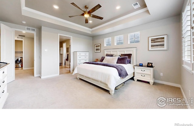 890 Meadowlark Dr, Erie, CO 80516 - bedroom featuring light carpet, visible vents, washer / dryer, and a raised ceiling