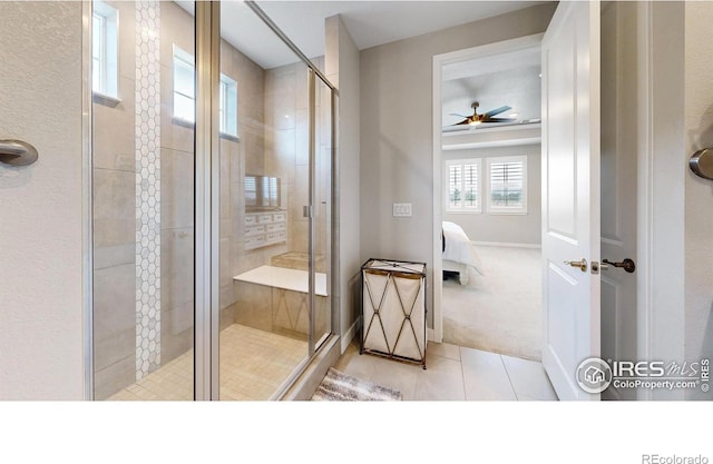 890 Meadowlark Dr, Erie, CO 80516 - bathroom featuring tile patterned flooring, a shower stall, a ceiling fan, and connected bathroom