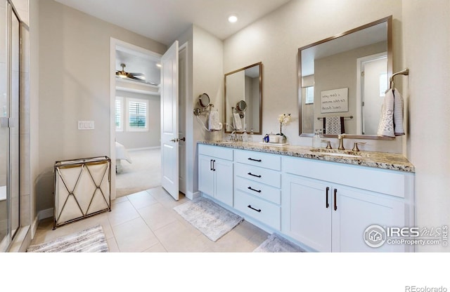 890 Meadowlark Dr, Erie, CO 80516 - ensuite bathroom with double vanity, tile patterned flooring, ensuite bath, and a sink