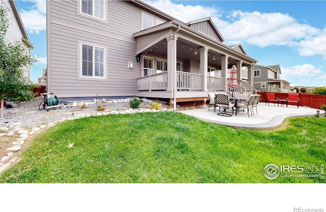 890 Meadowlark Dr, Erie, CO 80516 - back of property featuring a yard, a patio, and board and batten siding