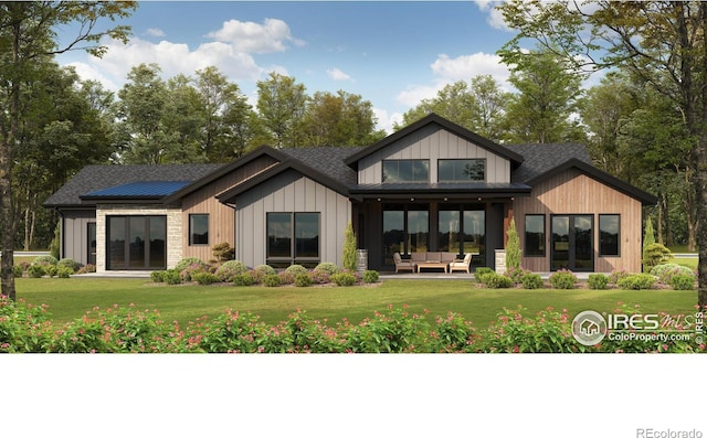 rear view of house featuring an outdoor living space, a lawn, and a shingled roof