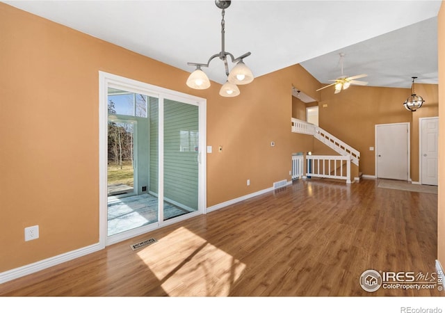 interior space featuring visible vents, baseboards, and wood finished floors