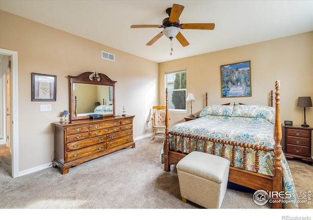 carpeted bedroom featuring visible vents, baseboards, and ceiling fan