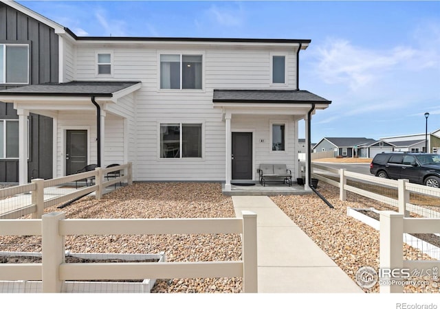 view of property featuring fence and board and batten siding