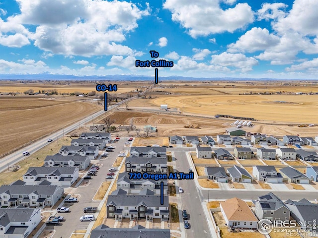 birds eye view of property with a residential view