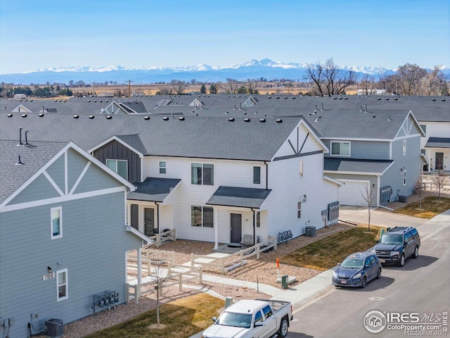 exterior space with a mountain view and a residential view