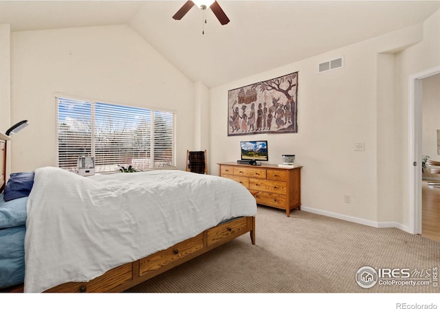 bedroom featuring visible vents, baseboards, light carpet, high vaulted ceiling, and a ceiling fan