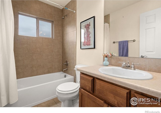 full bath featuring tile patterned flooring, shower / bath combination with curtain, toilet, and vanity