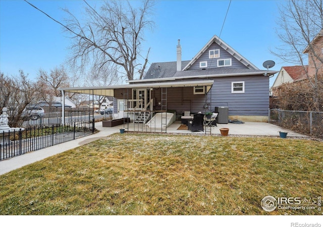 back of property featuring central air condition unit, a lawn, a chimney, a fenced backyard, and a patio area