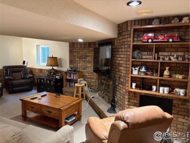 carpeted living area with a fireplace and a textured ceiling