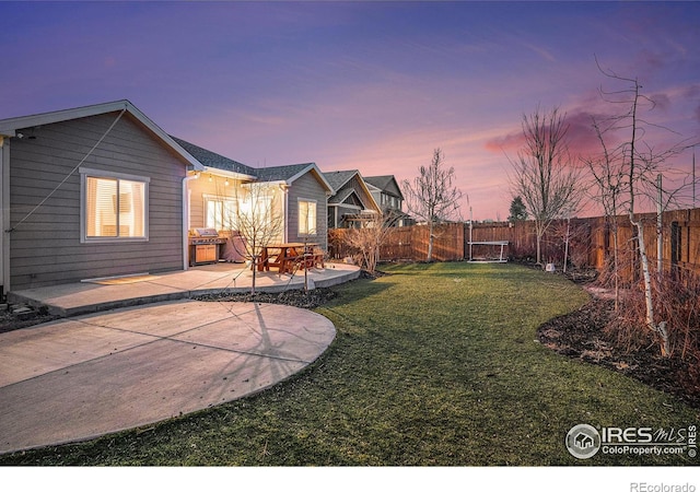 view of yard with a fenced backyard and a patio