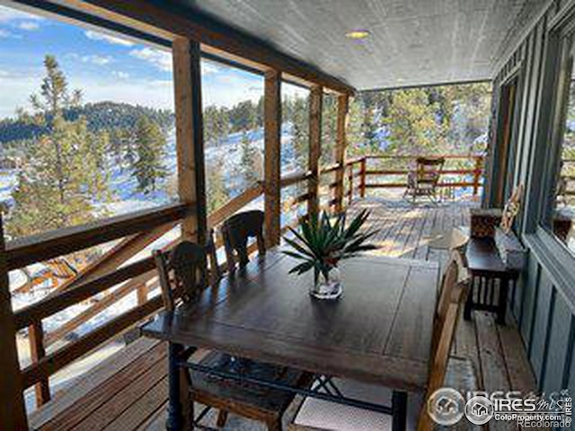 sunroom / solarium featuring plenty of natural light