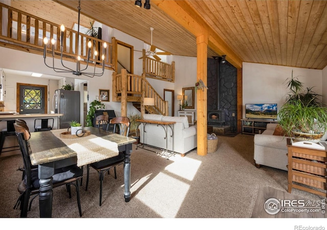 dining room with stairs, wooden ceiling, carpet flooring, and an inviting chandelier